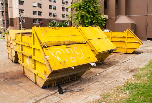 Company vehicle and skip at a roadside collection point